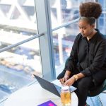Black woman tech worker using computer