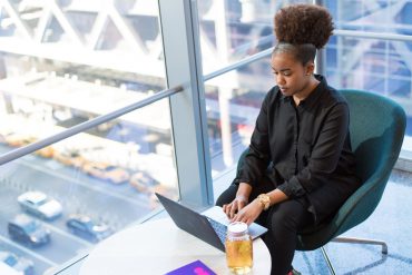 Black woman tech worker using computer