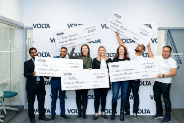 Volta pitch competition winners holding big $25,000 cheques
