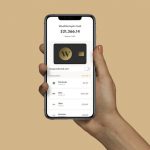 Hand holding phone with Wealthsimple Cash app open