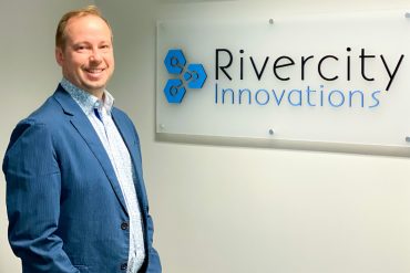 Jeff Shirley, co-founder and CEO, smiling at Rivercity Innovation's office
