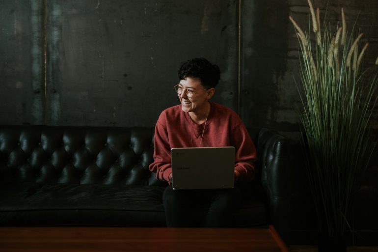 Smiling woman using a laptop