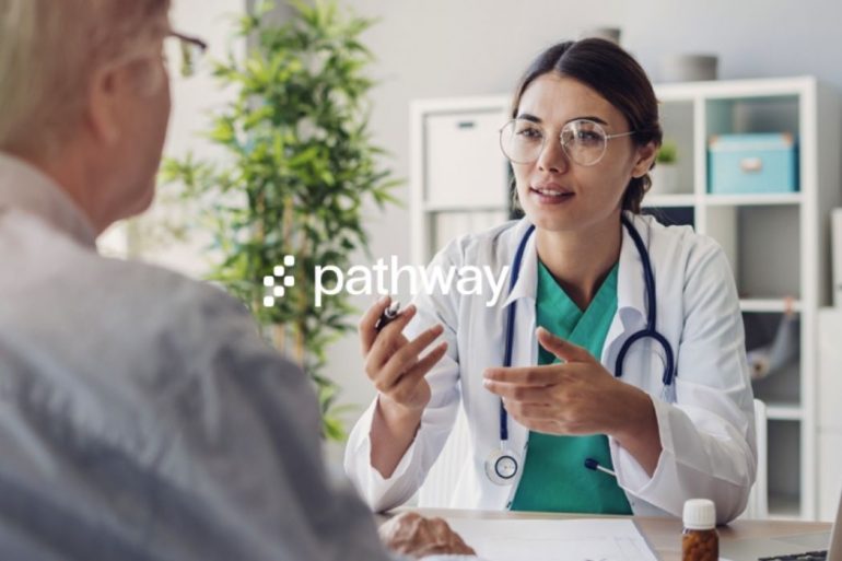 A doctor talking to a patient The pathway logo is on top of the entire image