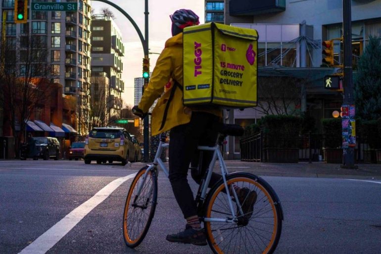Tiggy delivery person on a bike
