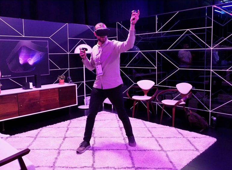 Man using VR headset in a purple room