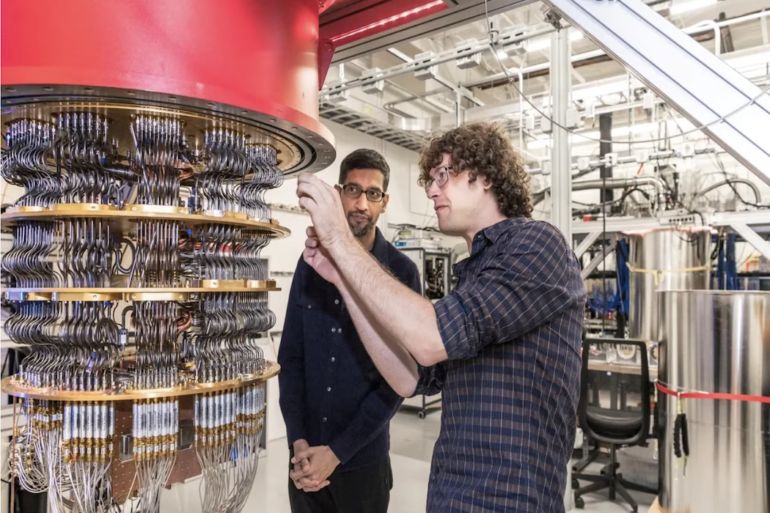 Two men working on a quantum computer