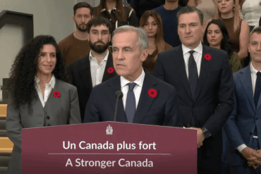 Mark Carney makes a funding announcement at AI research institute Mila.